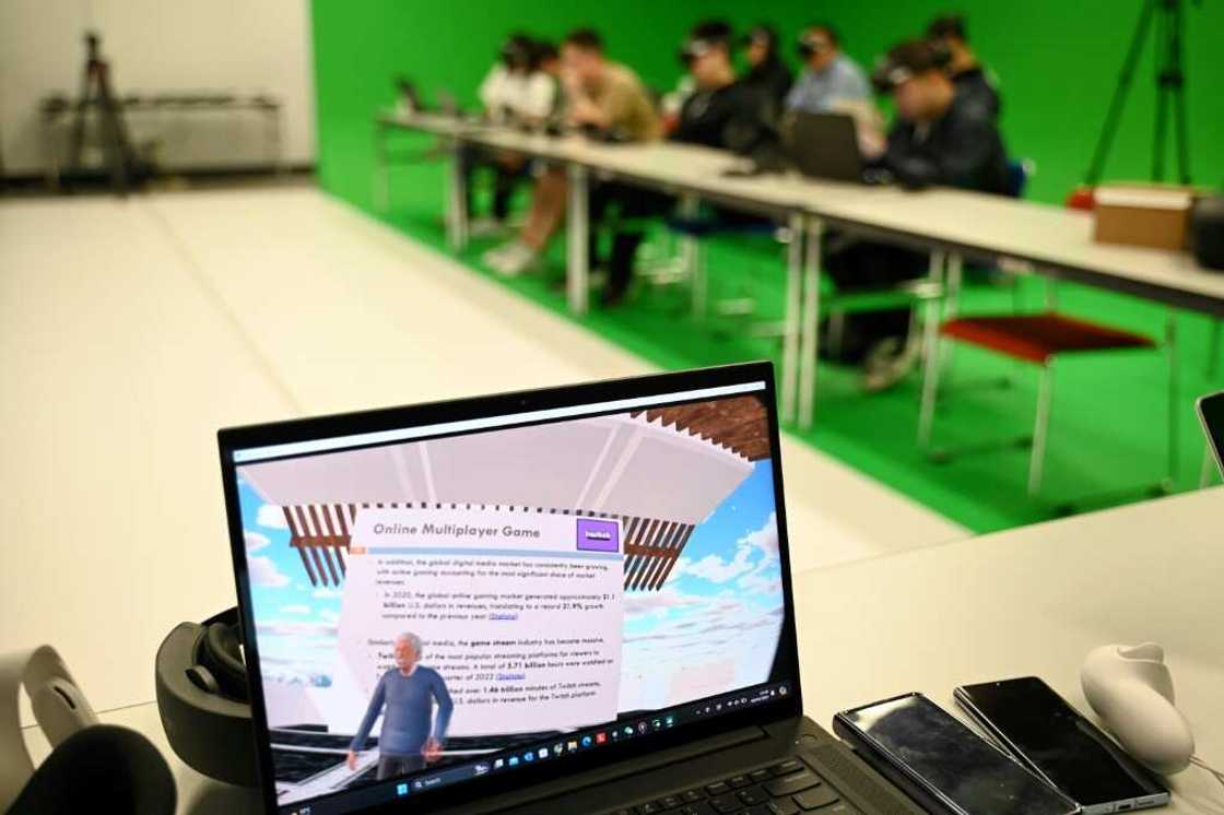 A laptop screen shows the first-person view of a virtual reality headset worn by a student at the Hong Kong University of Science and Technology A laptop screen shows the first-person view of a virtual reality headset worn by a student at the Hong Kong University of Science and Technology