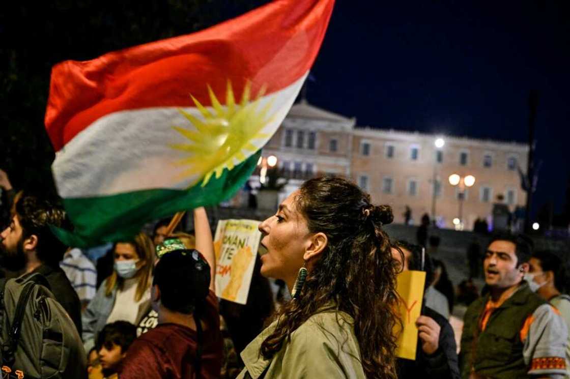 Iranians living in Greece wave a Kurdish flag while singing an Iranian protest song late last month -- one of many such protests worldwide in solidarity with those taking place in the Islamic republic Iranians living in Greece wave a Kurdish flag while singing an Iranian protest song late last month -- one of many such protests worldwide in solidarity with those taking place in the Islamic republic