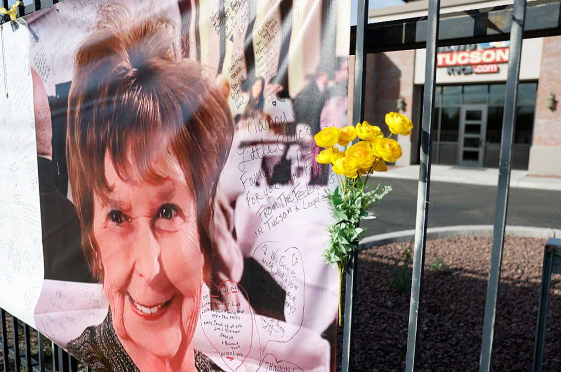 A banner of Nancy Guthrie displayed in front of a TV station A banner of Nancy Guthrie displayed in front of a TV station