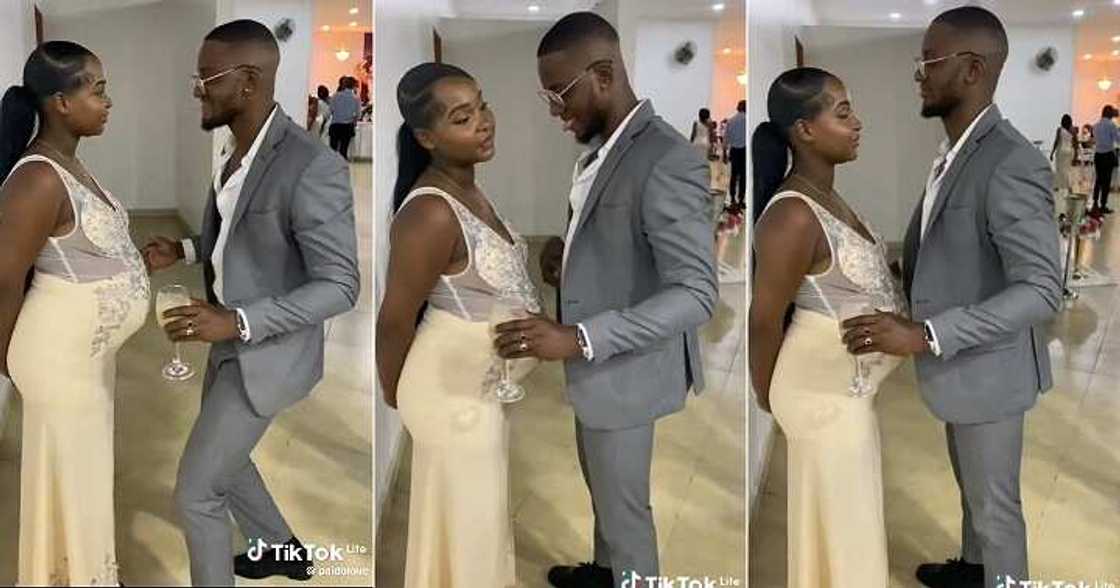 Man tries to make pregnant wife smile at party Man tries to make pregnant wife smile at party