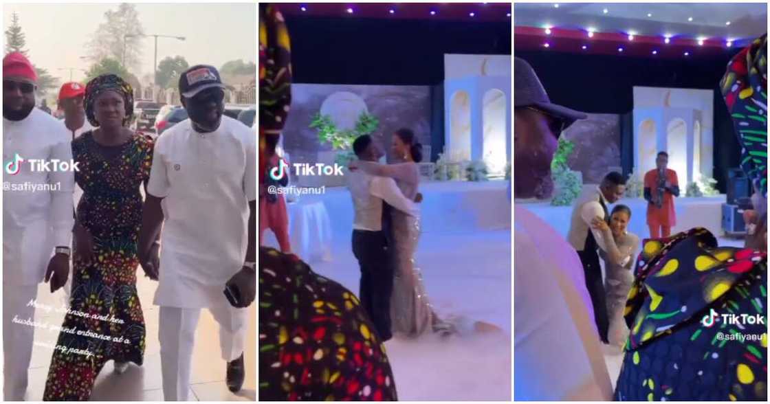 Bride kneels down to greet Mercy Johnson during her wedding.