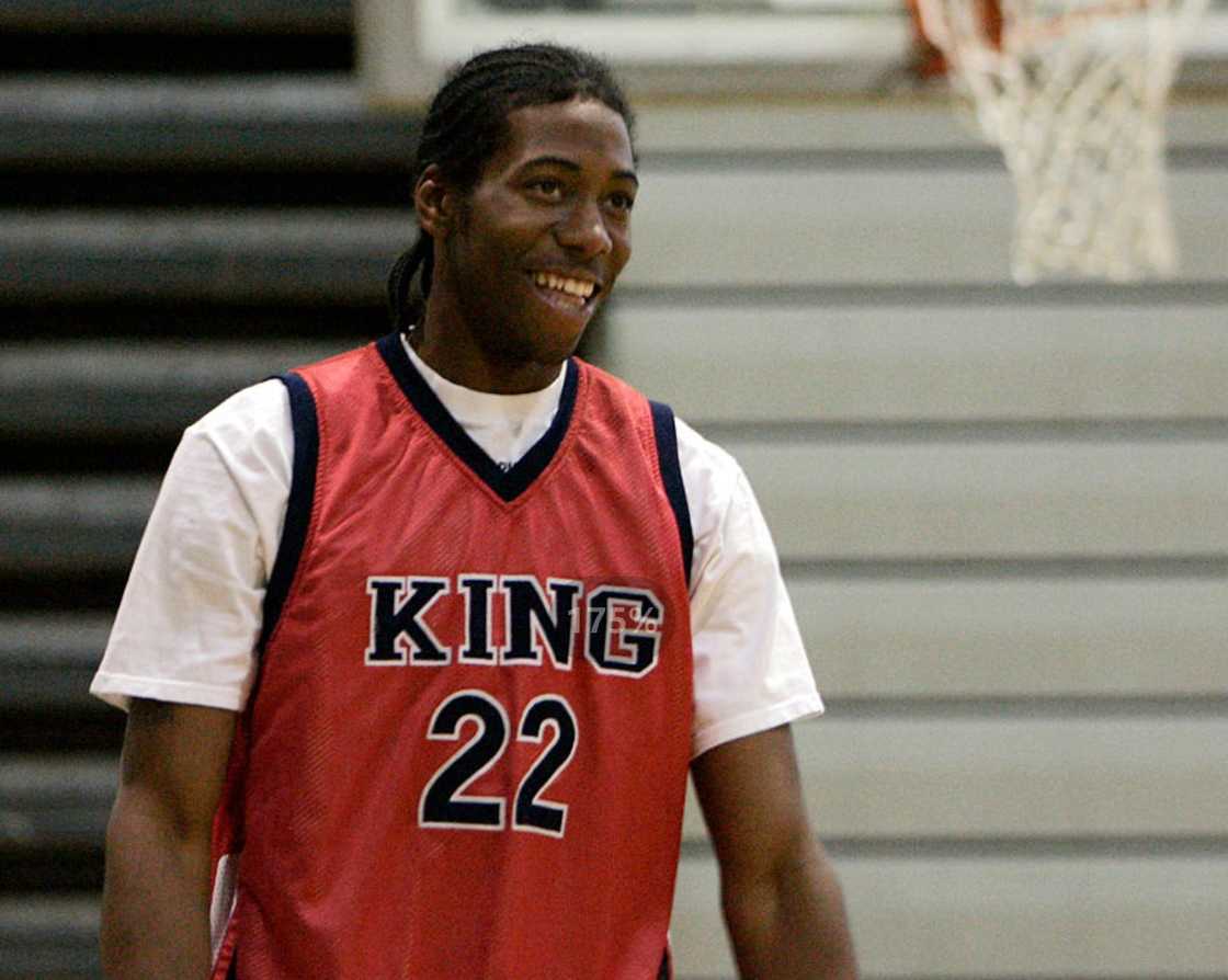 Kawhi Leonard smiles during a break in practice drills in Riverside