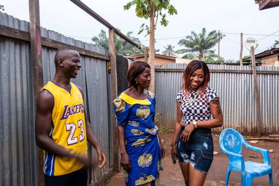 Family ties: With mum Cecile, centre, and brother Bachir