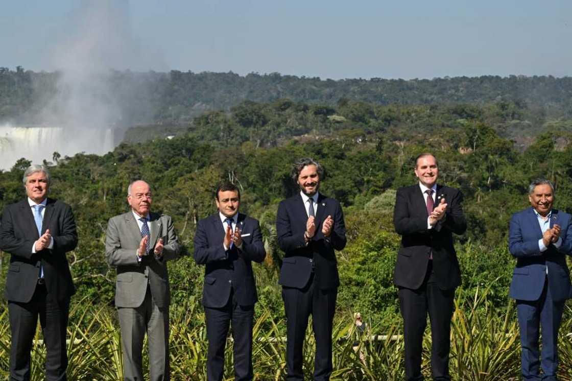 Uruguayan Foreign Minister Francisco Bustillo, Brazilian Foreign Minister Mauro Vieira, Governor of Misiones Oscar Herrera Ahuad, Argentine Foreign Minister Santiago Cafiero, Paraguayan Foreign Minister Julio Arriola and Bolivian Foreign Minister Rogelio Mayta at the Iguazu Falls in Argentina