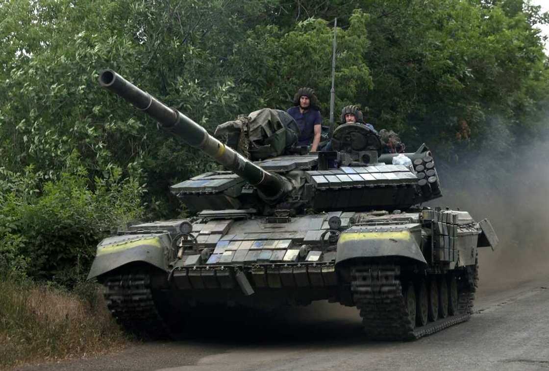 Military vehicles constantly pass back and forth through Siversk Military vehicles constantly pass back and forth through Siversk