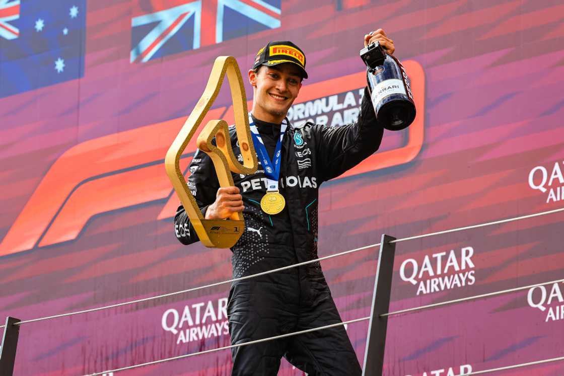 George Russell celebrates on the podium after the F1 Grand Prix of Austria George Russell celebrates on the podium after the F1 Grand Prix of Austria
