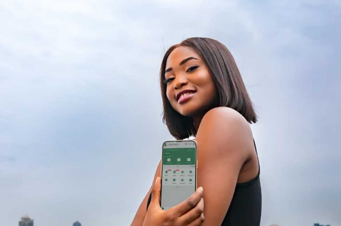 An OPay customer showing off her account on her smartphone An OPay customer showing off her account on her smartphone