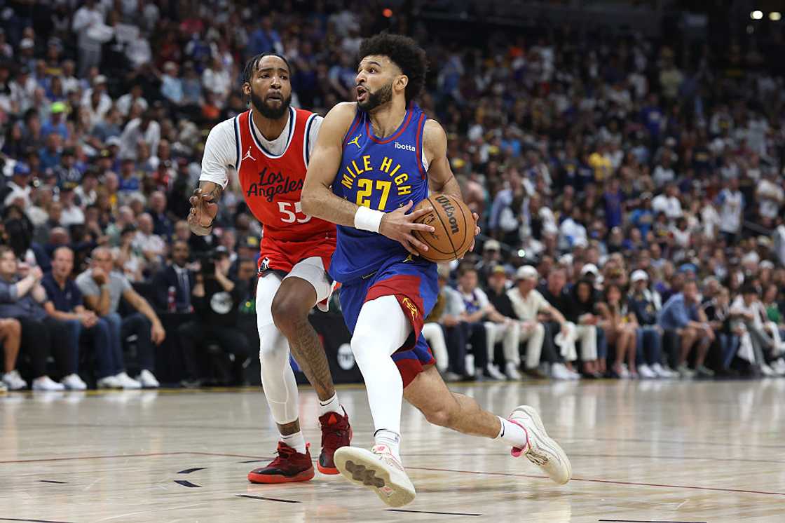 Jamal Murray of the Denver Nuggets drives the ball against Derrick Jones Jr. of the LA Clippers at Ball Arena in Denver, Colorado Jamal Murray of the Denver Nuggets drives the ball against Derrick Jones Jr. of the LA Clippers at Ball Arena in Denver, Colorado