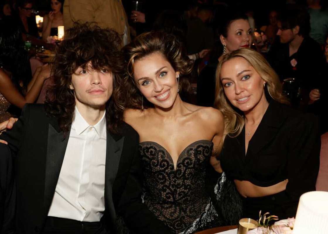 Maxx Morando, Miley Cyrus, and Brandi Cyrus at The 66th Annual Grammy Award
