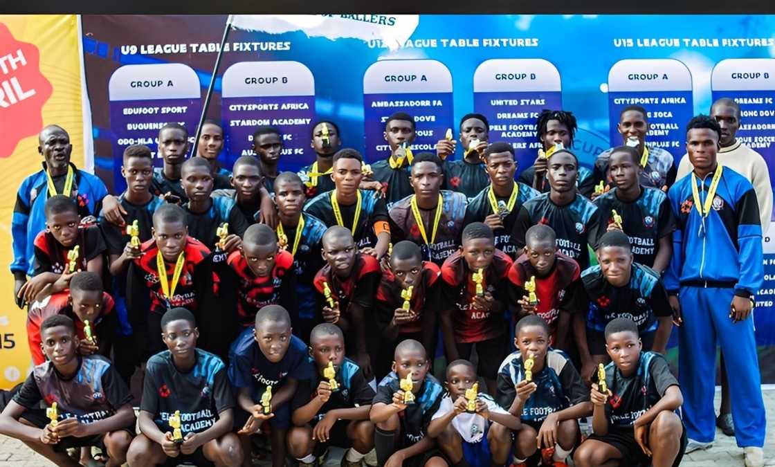 Pele Football Academy team posing for a photo with their medals