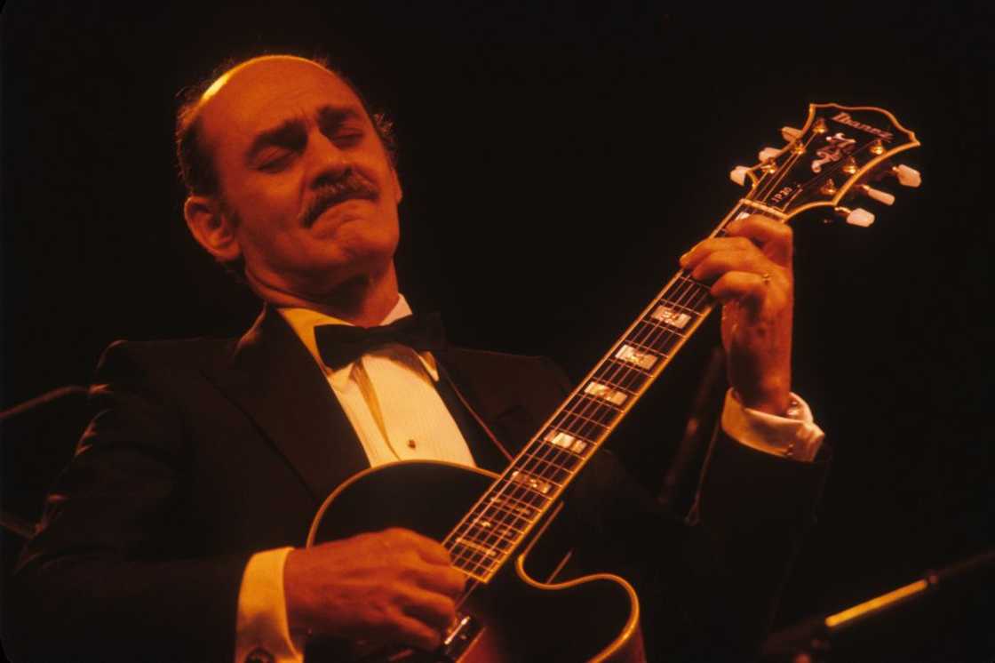 American jazz guitarist Joe Pass playing guitar American jazz guitarist Joe Pass playing guitar