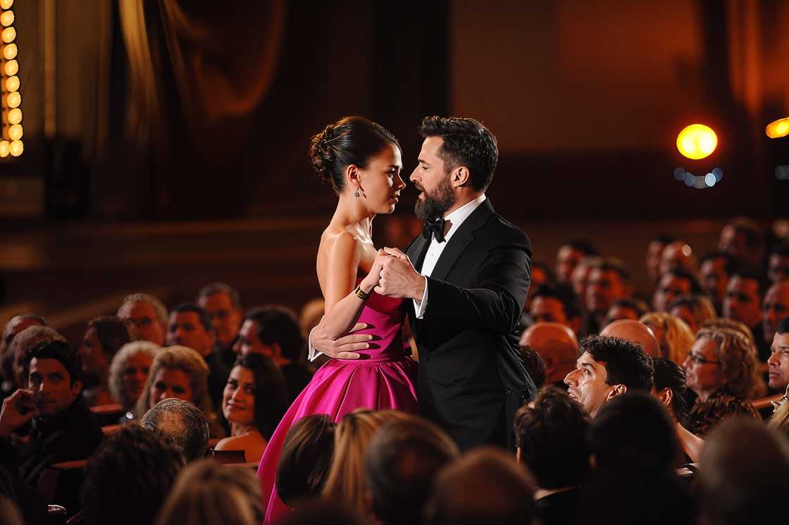 Hugh Jackman and Sutton Foster dance in a crowded room