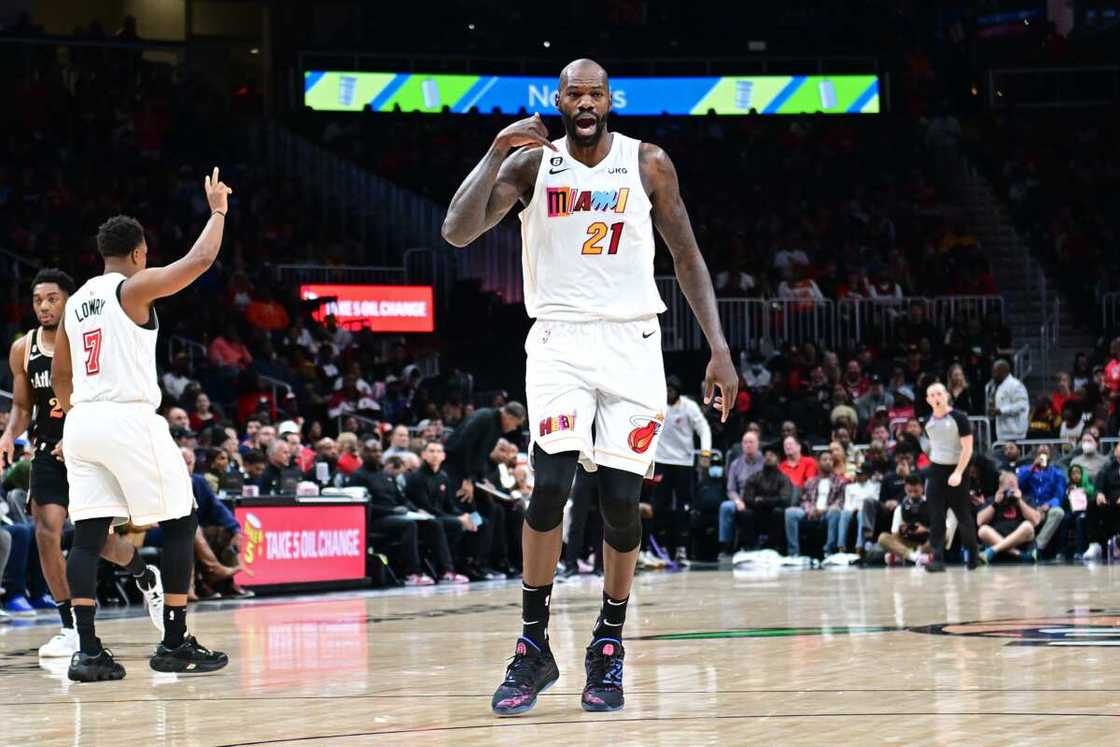 Dewayne Dedmon, #21 of the Miami Heat, celebrates during the game against the Atlanta Hawks at State Farm Arena Dewayne Dedmon, #21 of the Miami Heat, celebrates during the game against the Atlanta Hawks at State Farm Arena