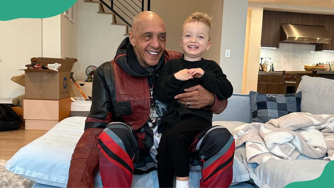 Logic's father, Robert Bryson Hall Sr. with his grandson.