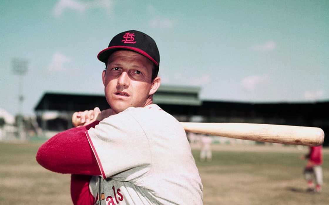Stan Musial poses with a baseball bat Stan Musial poses with a baseball bat