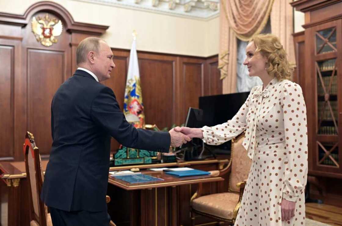 Russian Children's Rights Commissioner Maria Lvova-Belova (R, with Russian President Vladirmir Putin) was accused by the US of directing an operation to remove children from Ukraine to place with Russian families. Russian Children's Rights Commissioner Maria Lvova-Belova (R, with Russian President Vladirmir Putin) was accused by the US of directing an operation to remove children from Ukraine to place with Russian families.