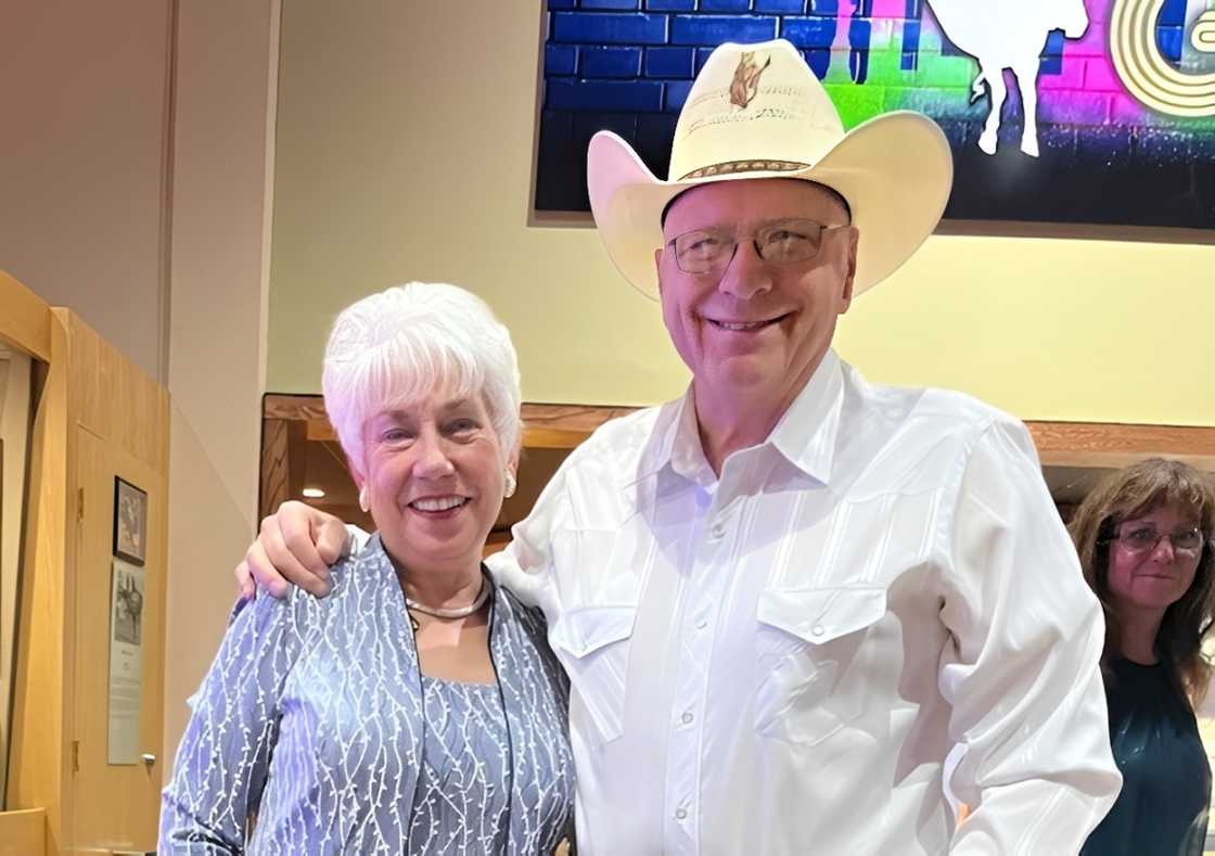 Pake McEntire holding a smiling woman