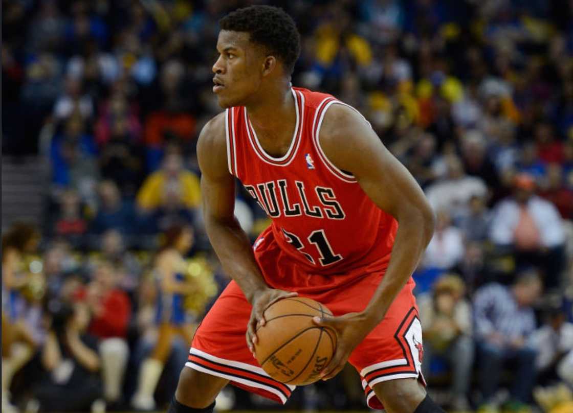 Jimmy Butler looks to pass the ball against the Golden State Warriors at Oracle Arena