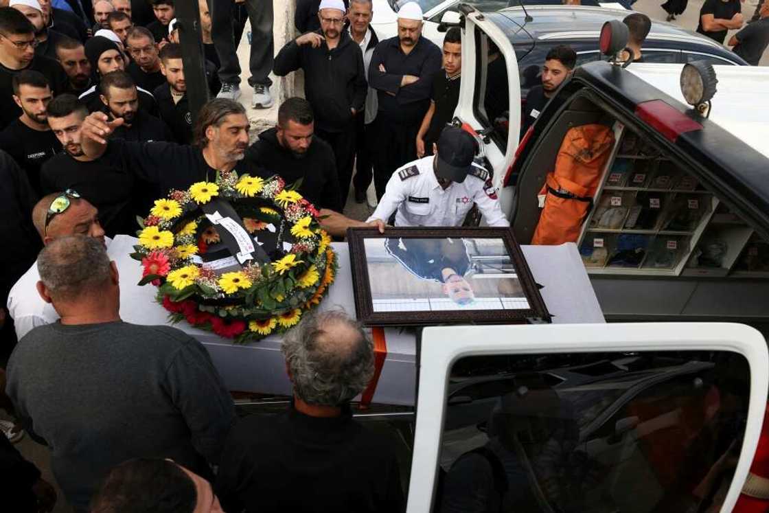 Israeli Druze men carry the coffin of 17-year-old Tiran Fero, during his funeral procession on Thursday in Daliyat al Karmel