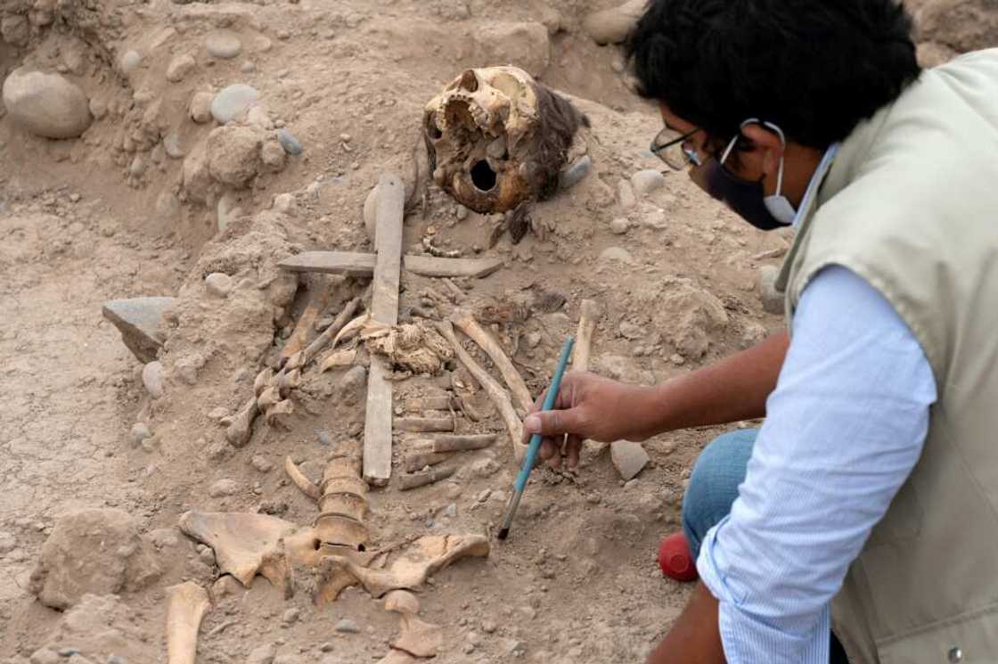 Researchers said a wooden cross found at the site marked the region's shift to Christianity