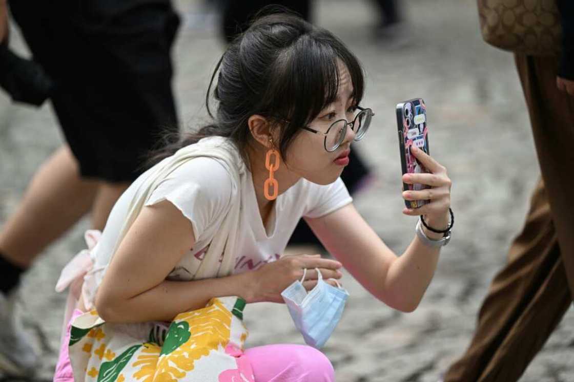 A Chinese tourist takes a photo in Macau during the country’s week-long holiday at the start of October