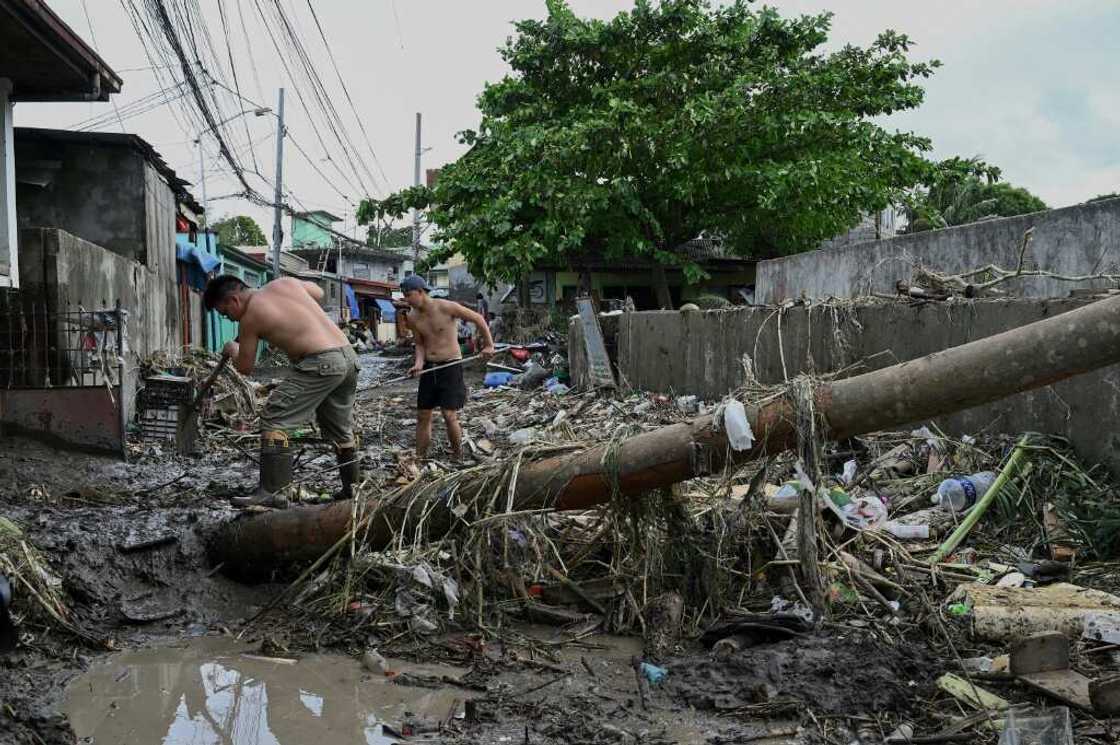 The death toll from floods and landslides unleashed by a tropical storm in the Philippiones jumps sharply to 98 The death toll from floods and landslides unleashed by a tropical storm in the Philippiones jumps sharply to 98