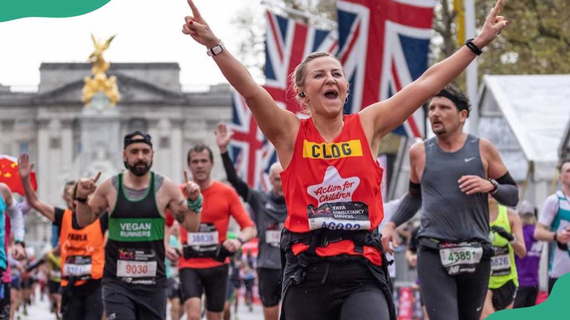 A marathon participant celebrates completion of a race