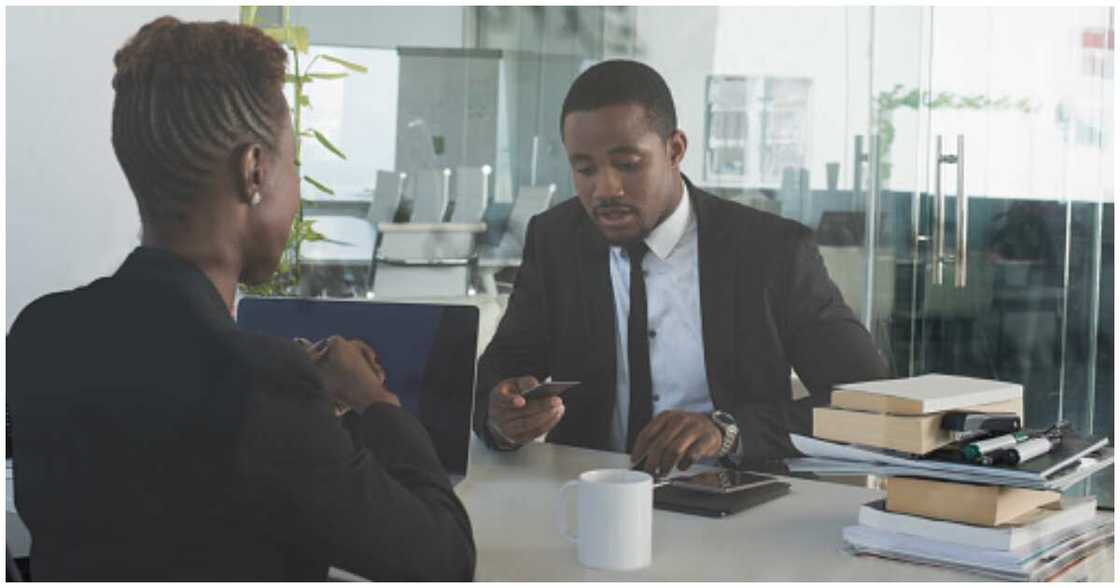 Female banker, Nigerian man