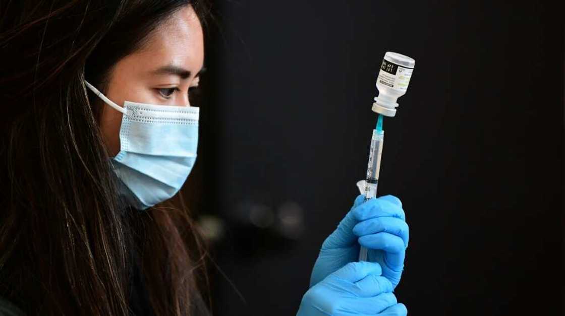 A health worker prepares to administer a vaccine in Los Angeles, California in January 2022 A health worker prepares to administer a vaccine in Los Angeles, California in January 2022