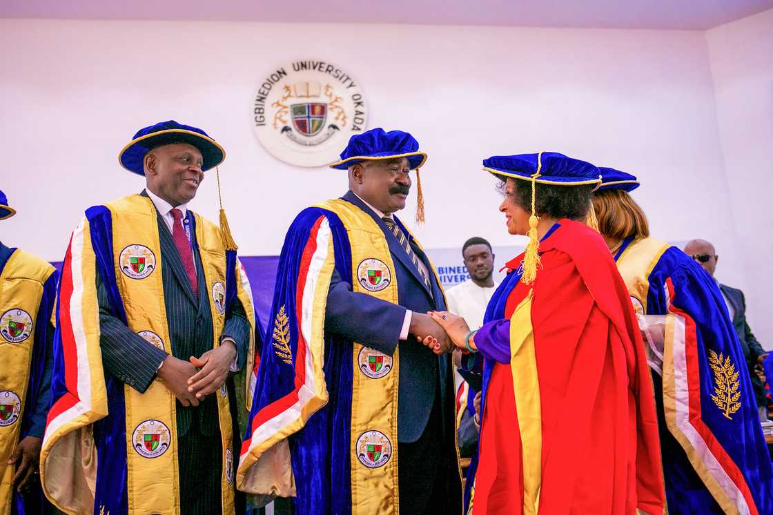 Igbinedion University scholars exchange pleasantries at an academic ceremony Igbinedion University scholars exchange pleasantries at an academic ceremony