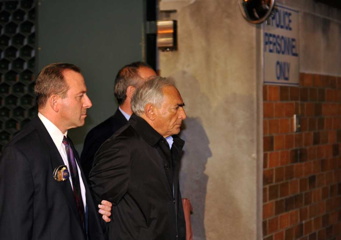 Former IMF head Dominique Strauss-Kahn (R) is taken out of a New York police station 2011 Former IMF head Dominique Strauss-Kahn (R) is taken out of a New York police station 2011