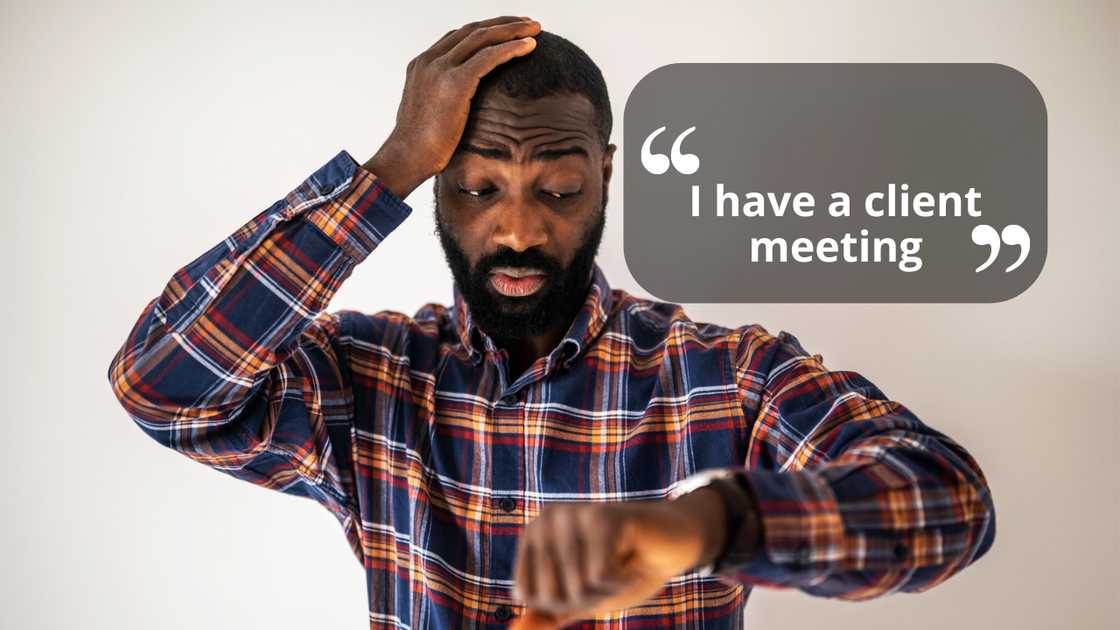 A man looking at his wristwatch