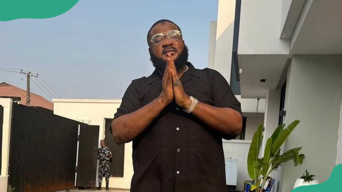 Sam Larry outdoors in a black shirt. Sam Larry outdoors in a black shirt.