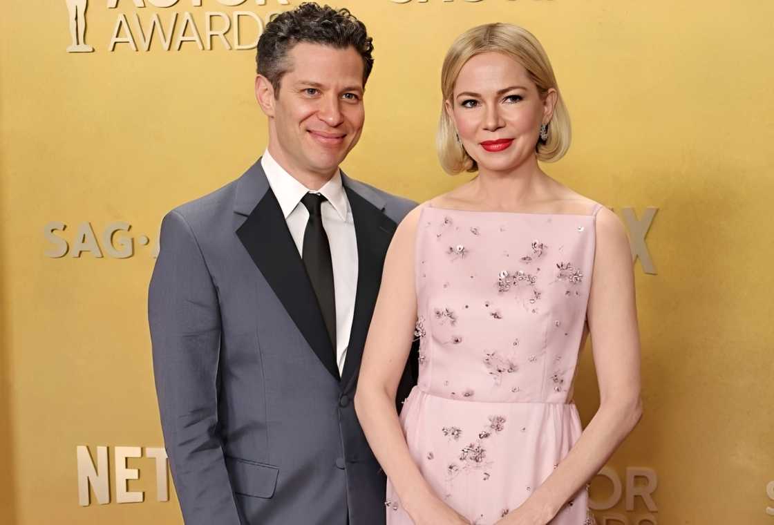 Thomas Kail and Michelle Williams pose on the red carpet Thomas Kail and Michelle Williams pose on the red carpet