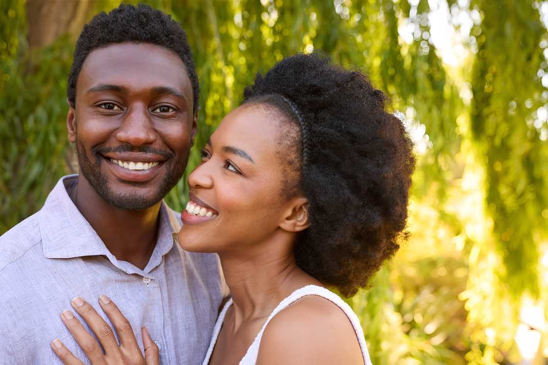 Portrait of a loving couple outdoors, hugging Portrait of a loving couple outdoors, hugging
