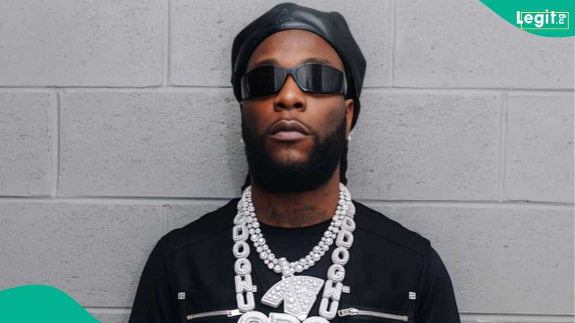 Burna Boy takes his ₦9bn Bugatti out in Lagos as a fan slips and falls in front of the luxury car