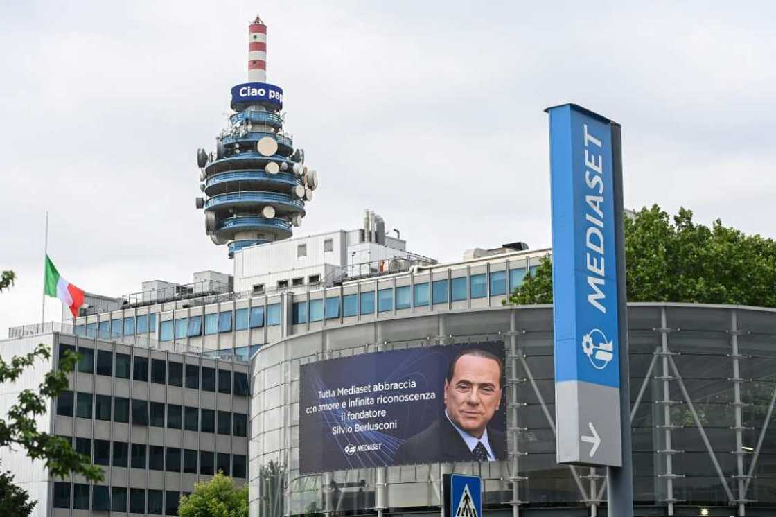 Silvio Berlusconi's portrait looms over the Mediaset HQ at Cologno Monzese outside Milan Silvio Berlusconi's portrait looms over the Mediaset HQ at Cologno Monzese outside Milan