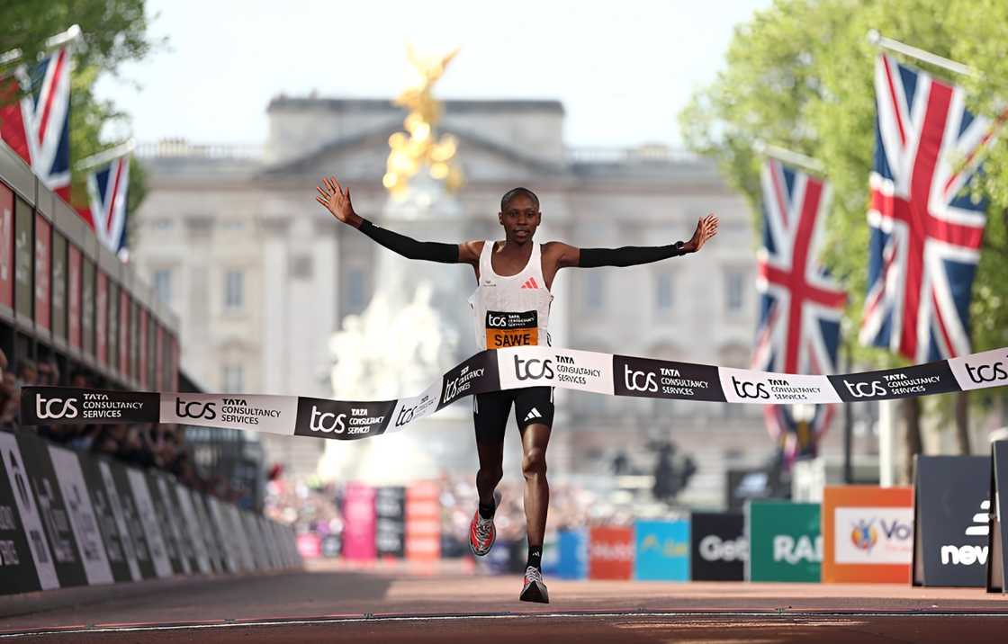 First placed Sabastian Sawe of Team Kenya celebrates as he crosses the finish line to win the Men's 2025 TCS London Marathon