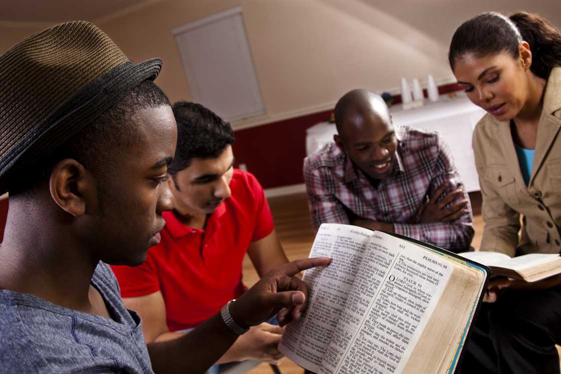 Young adults meeting together in a Bible study.