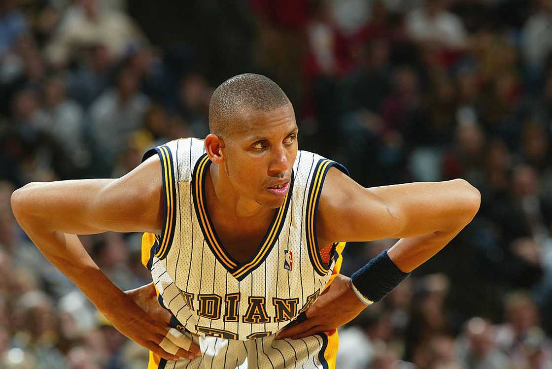 Reggie Miller stands on the court during the game against the Toronto Raptors