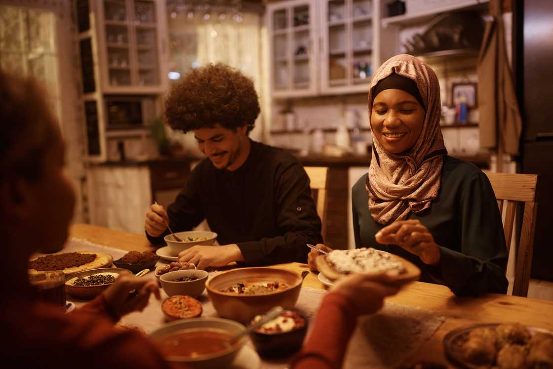 Muslim family enjoying dinner Muslim family enjoying dinner