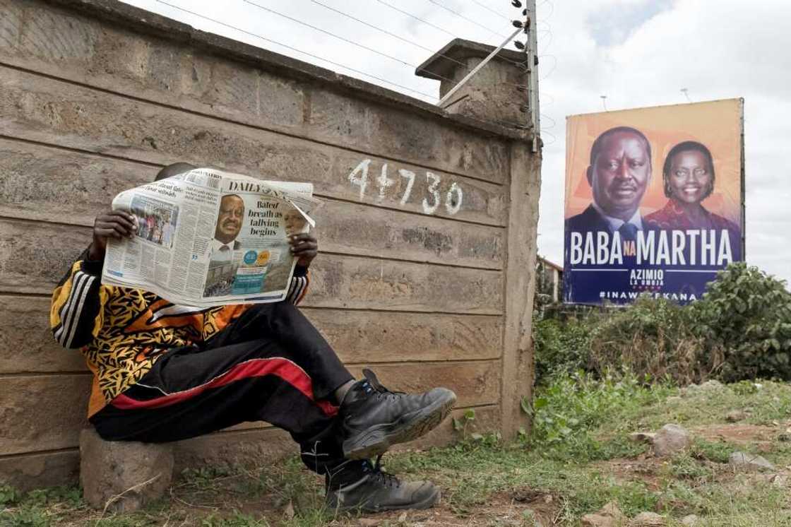 The race is currently too close to call between presidential frontrunners William Ruto and Raila Odinga (left on the billboard) The race is currently too close to call between presidential frontrunners William Ruto and Raila Odinga (left on the billboard)