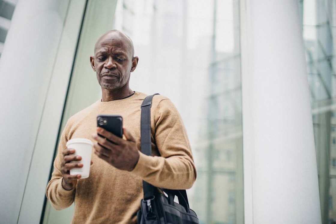 A man looking at his phone A man looking at his phone