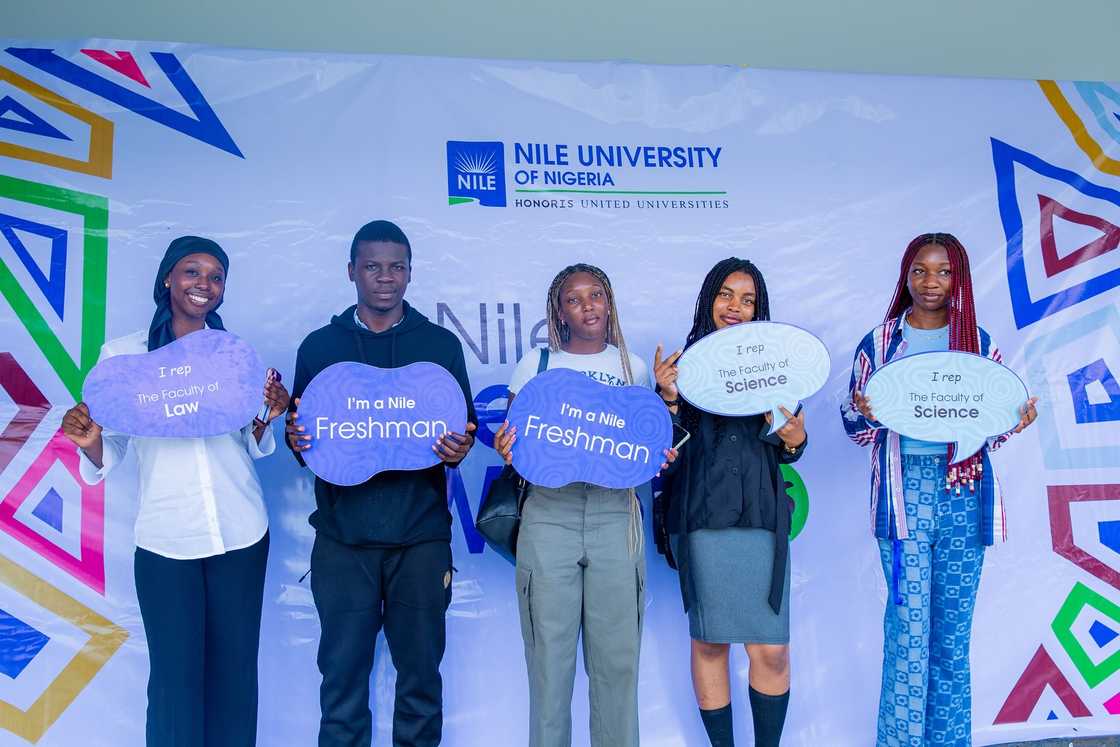 Nile University new students holding banners Nile University new students holding banners
