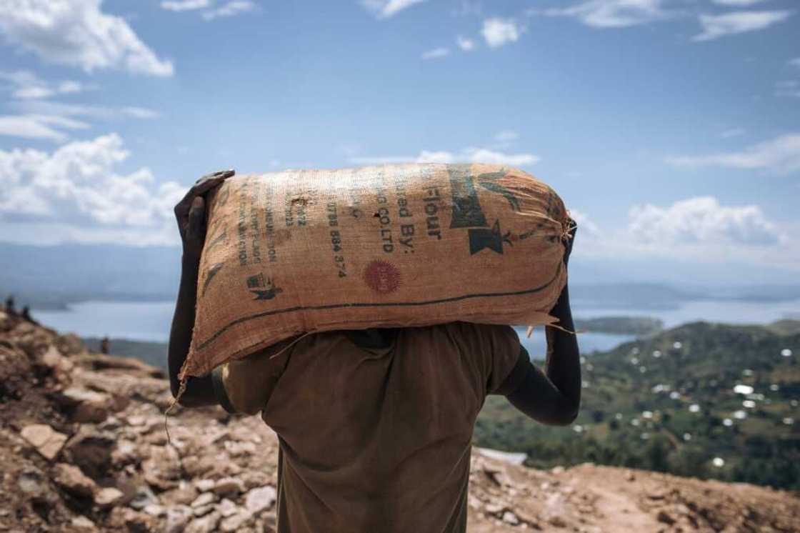 A miner in Luhihi hauls away spoil which will be carefully sifted for specks of gold