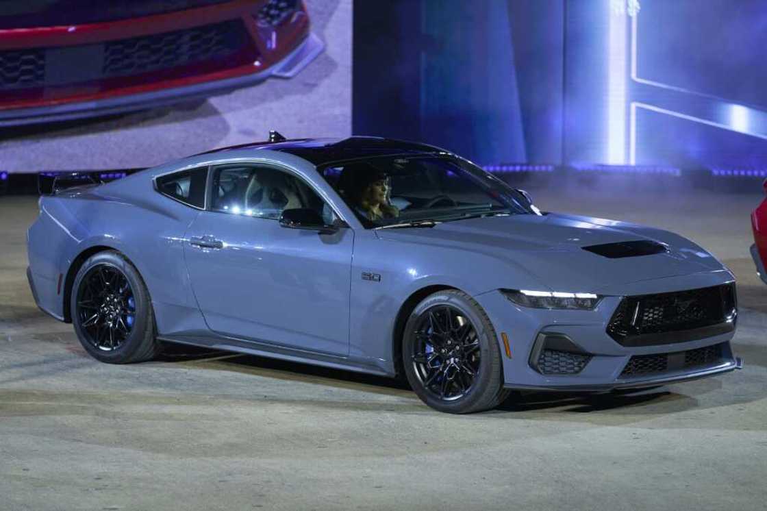 A Ford Mustang GT sits on stage during its debut at the North American International Auto Show in Detroit, Michigan on September 14, 2022