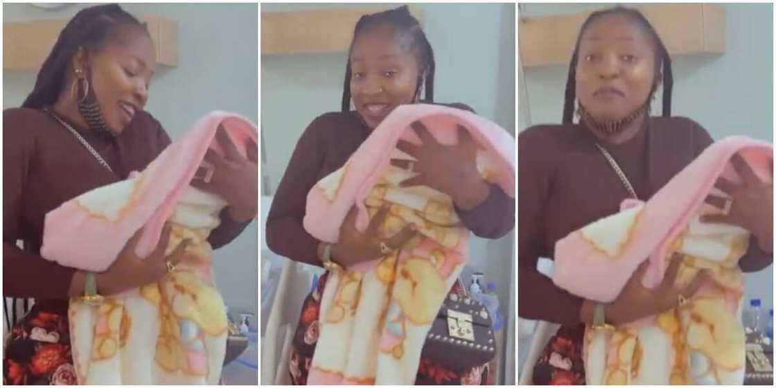 Anita Joseph lovingly holds Uche Ogbodo's baby Anita Joseph lovingly holds Uche Ogbodo's baby