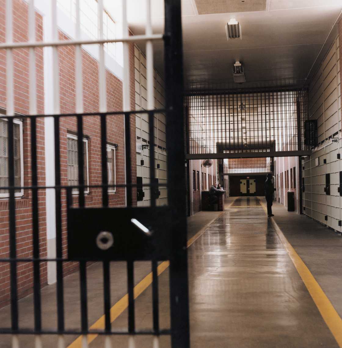 Prison house captured beside a gate. Prison house captured beside a gate.