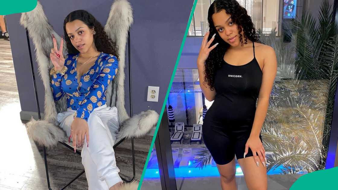 Jazlyn MyChelle poses in a blue floral top and a black outfit