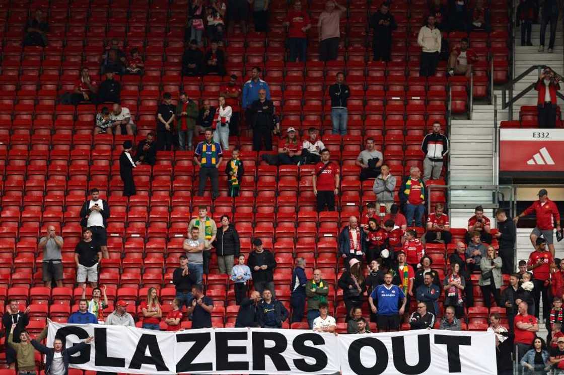 Manchester United fans protest against club owners the Glazer family after a match between Manchester United and Nottingham Forest on August 26, 2023